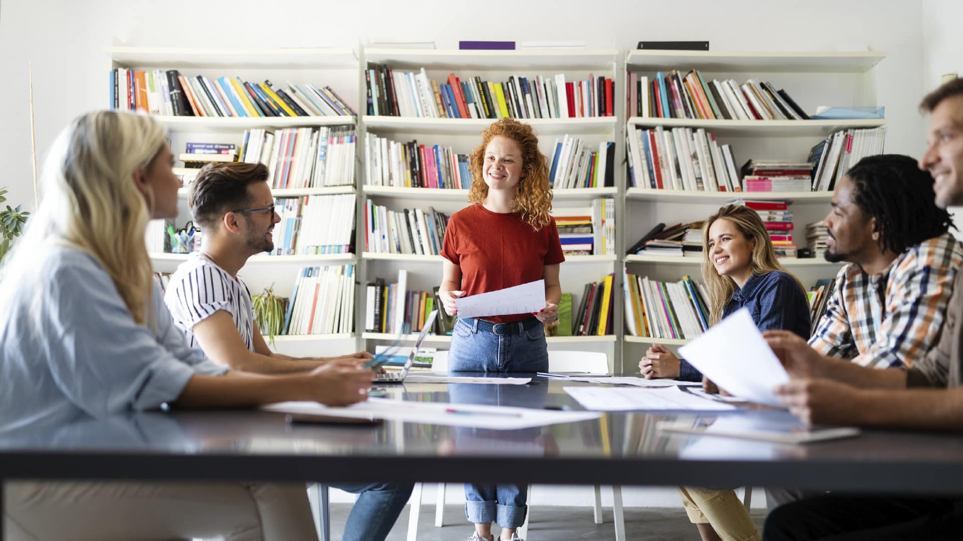 Diverse creative team brainstorming and collaborating during a meeting