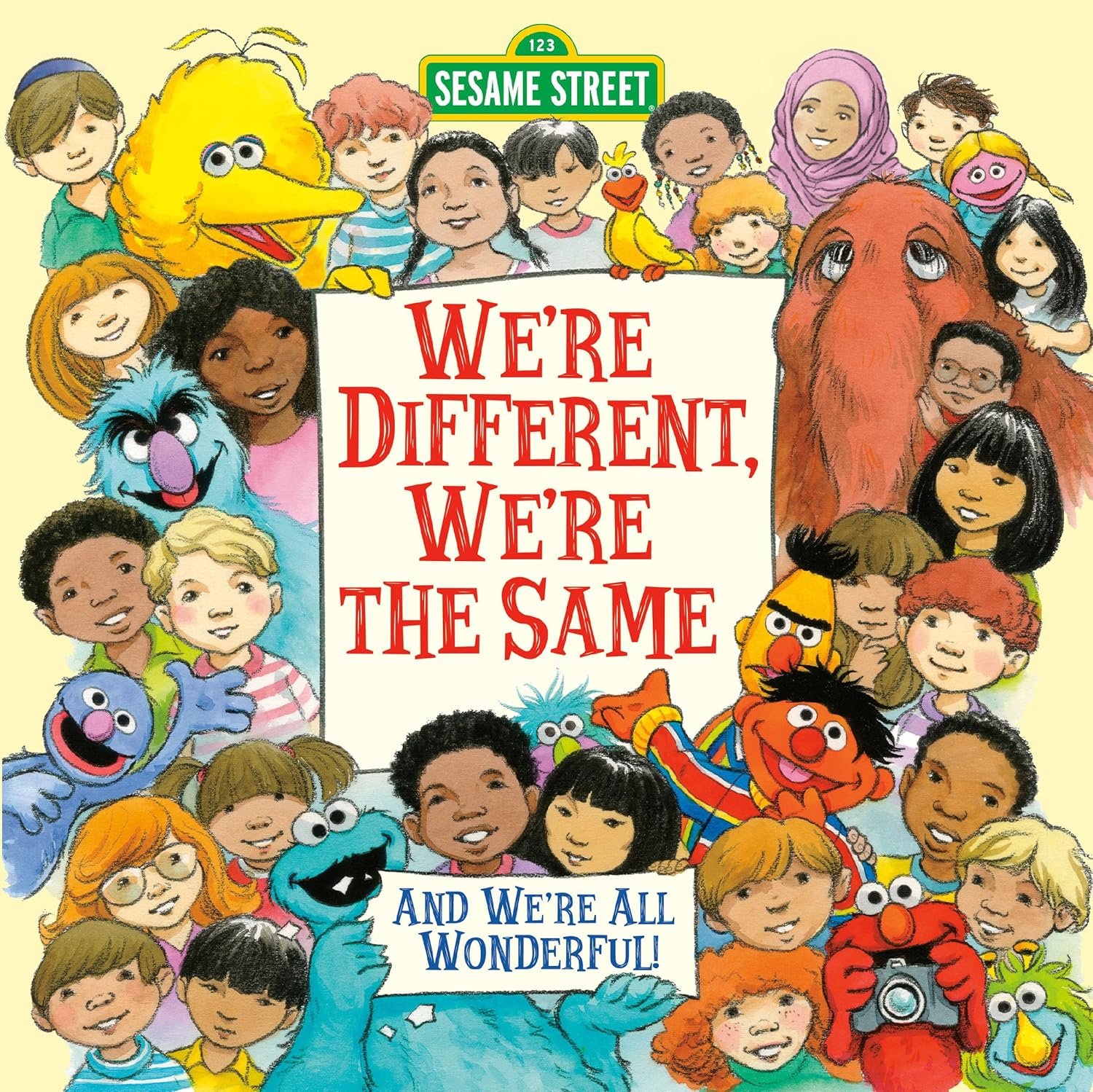Book cover for 'We're Different, We're the Same' by Bobbi Kates, showing Elmo and his Sesame Street friends happily celebrating diversity and common bonds.